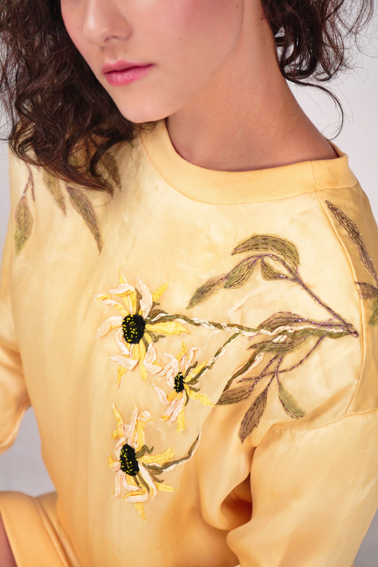 Contemporary sweat shirt dress with hand embroidery over the shoulder