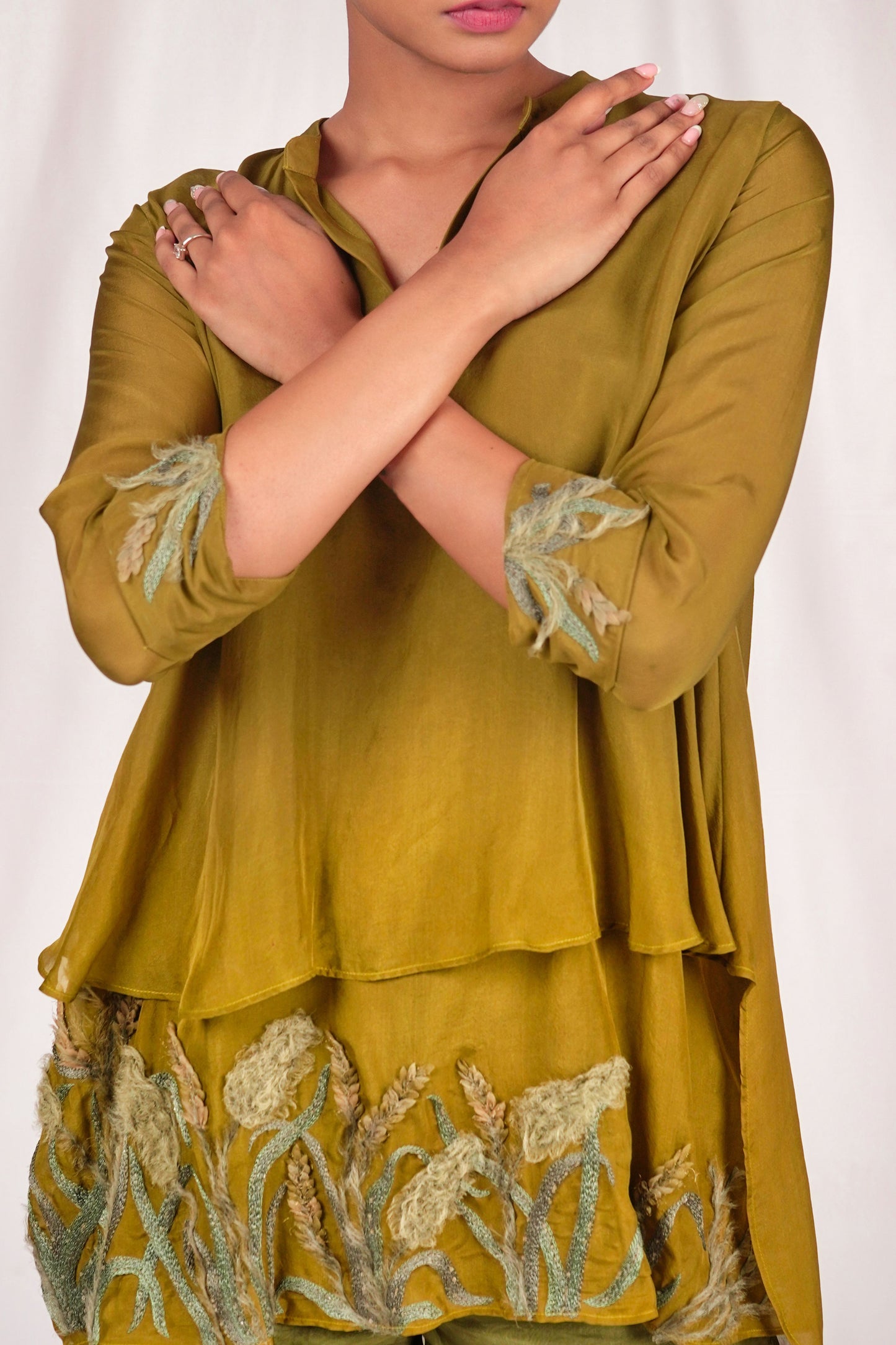 Two layered high and low top with embroidery on folded cuff and bottom layer