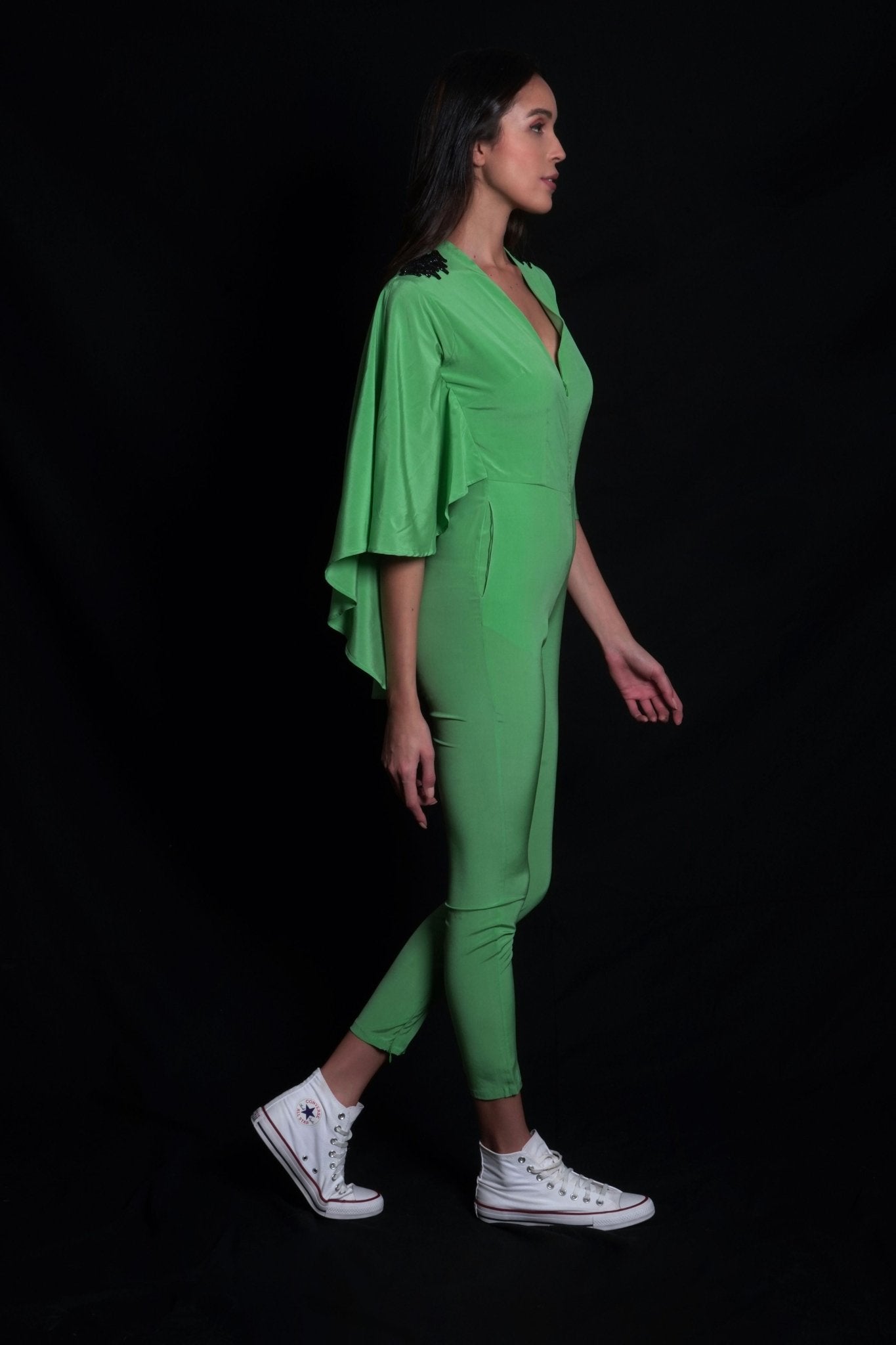 Absinthe green jumpsuit featuring hand-embroidery on shoulders